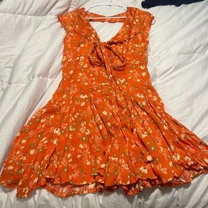 Free people orange floral dress

Size small never worn